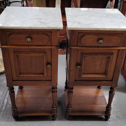 Antique French Oak Henry II white marble top bedside cabinets. They have one drawer and cupboard a long with an open shelf at the bottom. Sourced from France and in good original detailed condition.