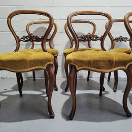 Set of six upholstered Victorian balloon back chairs. In good original detailed condition.