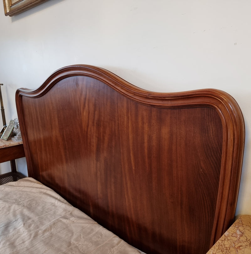 Beautiful French Walnut Louis XV style queen size bed with carving on the feet and in good original detailed condition.