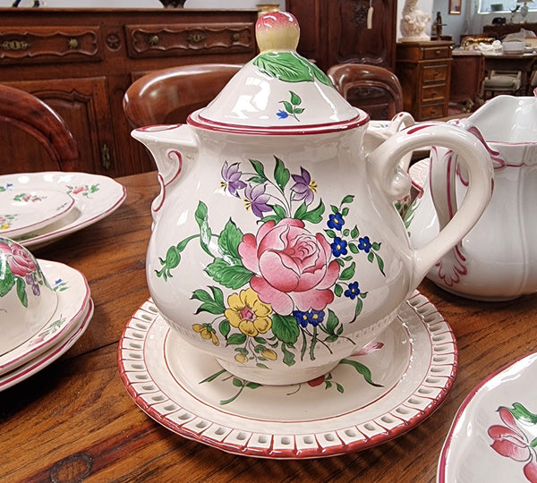 A pretty French table setting made in France called Luneville. It consists of plates, cups, saucers, tea pot, milk jug, sugar bowl, tureens and cake plates a total of 53 pieces. Please view photos as they help form part of the descriptions.