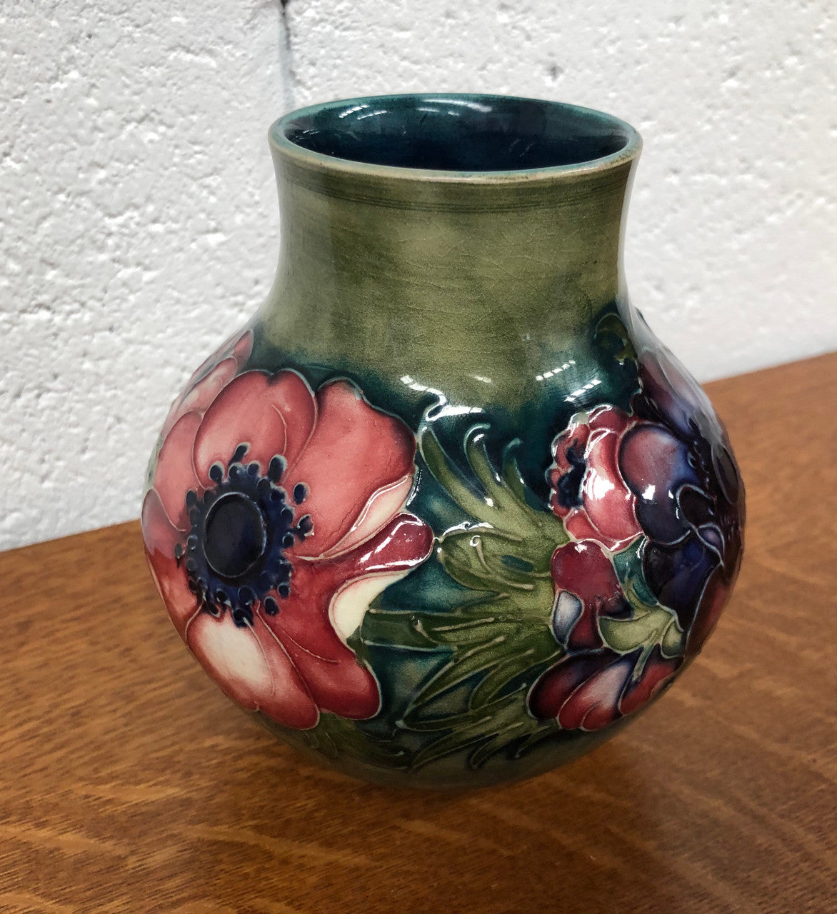 Anemone pattern hand-painted Moorcroft vase, in good condition.