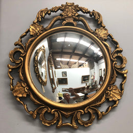 French gilt wood round convex mirror. In good original condition.
