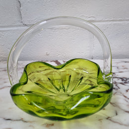 Delightful art glass vintage basket. Green glass bowl and clear handle.
