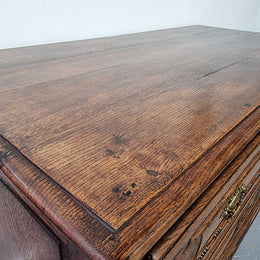 Early 19th Century French Oak chest of three drawers. It has beautiful handles and carvings. It is in good original detailed condition.