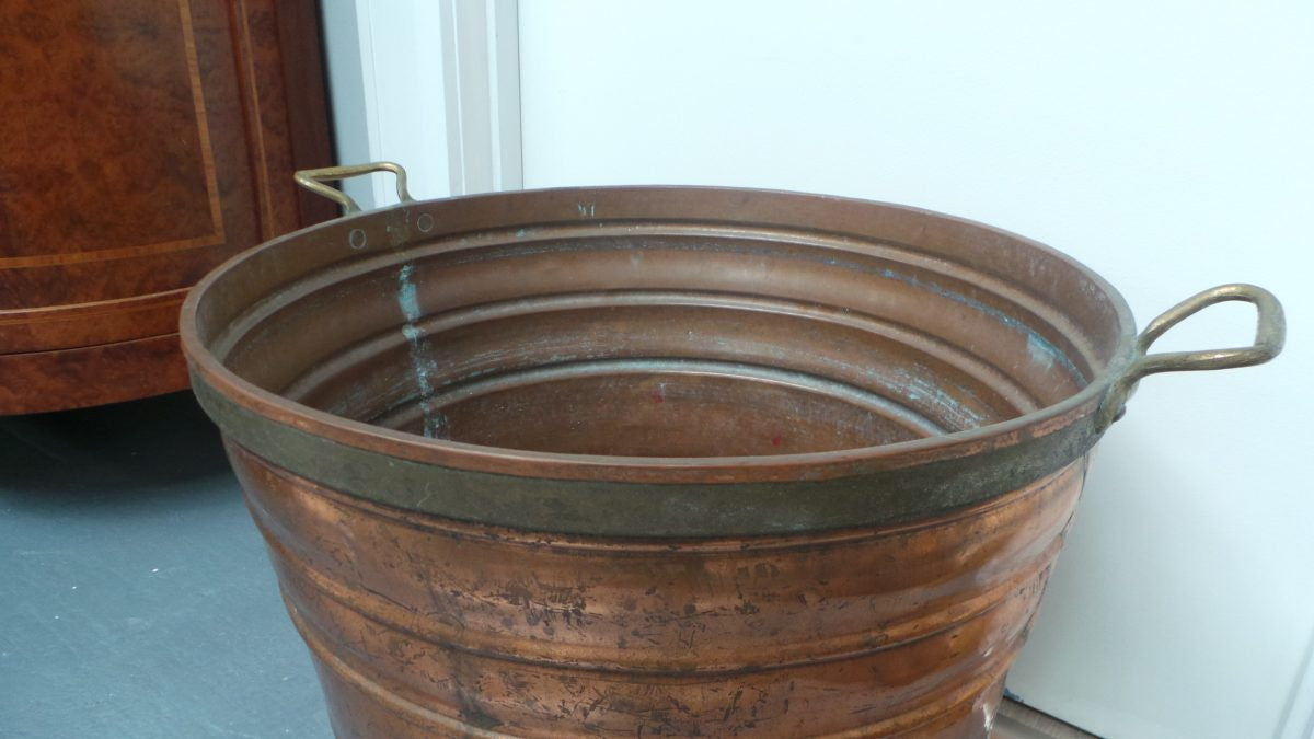 A fabulous French rustic antique copper and brass two handled bucket. Has loads of character and would make a great bucket for firewood. It is in very good original condition