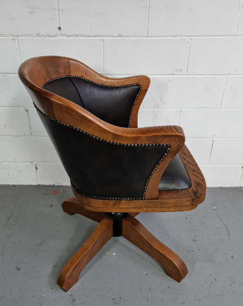 Antique French Oak newly upholstered "swivel action" office desk chair. In very good condition and very comfortable to sit in.