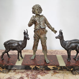 French Art Deco spelter and marble statue of a boy and two deers in good original condition.
