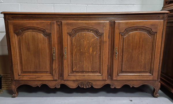 Charming French Louis 15th style sideboard with three doors and a stunning wooden top. In good detailed condition. Circa 1900
