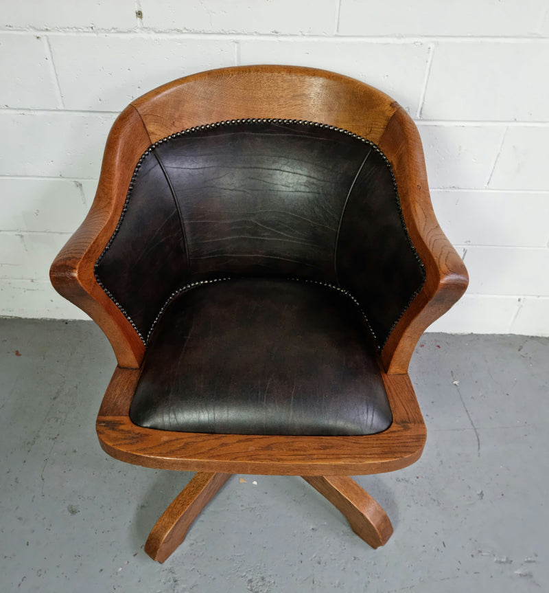 Antique French Oak newly upholstered "swivel action" office desk chair. In very good condition and very comfortable to sit in.