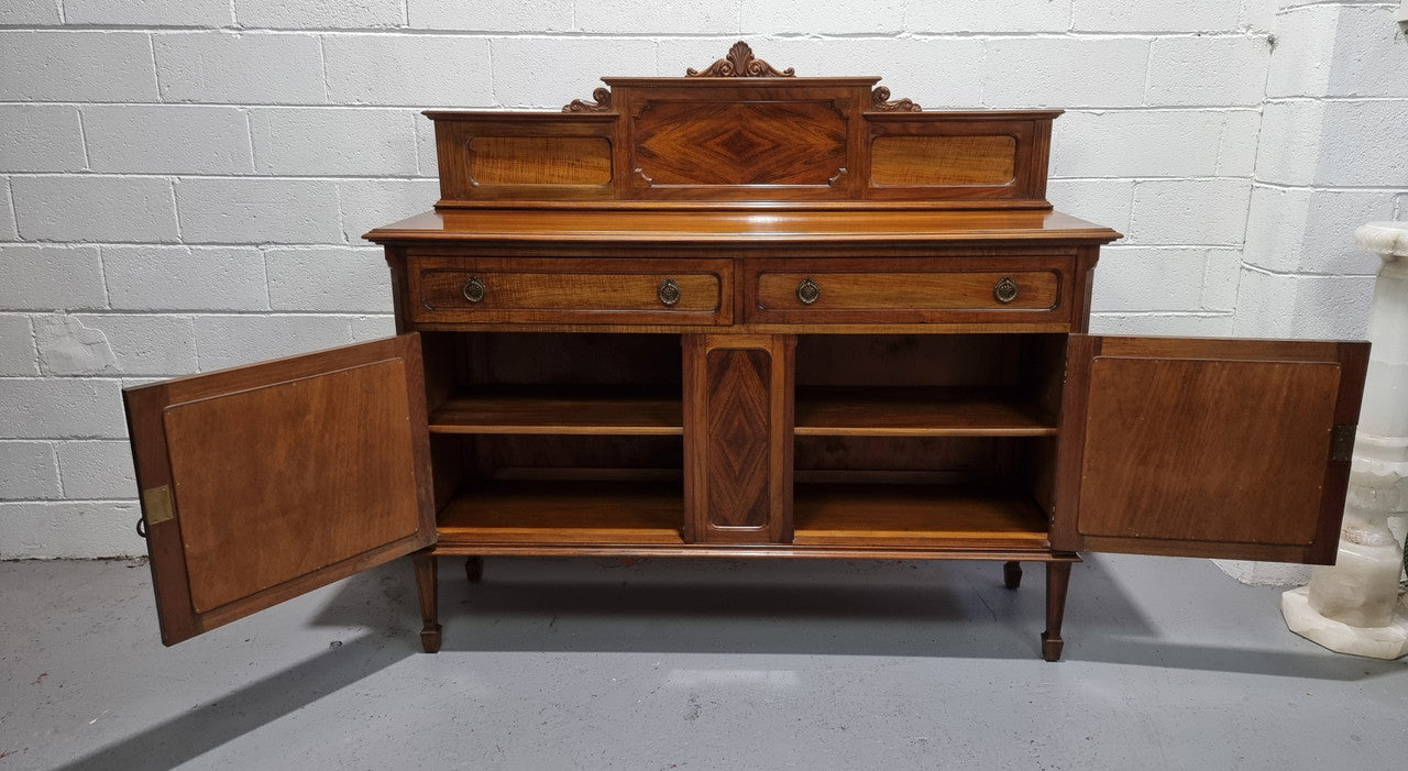 Fabulous Antique two door Blackwood and Fiddleback sideboard with lovely presence and also plenty of room for storage. In original detailed condition.