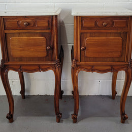 Pair of stunning Louis XV style French Walnut white marble top bedside cabinets. They have one drawer and a cupboard that is marble lined. The marble has been polished and they are in good original detailed condition.