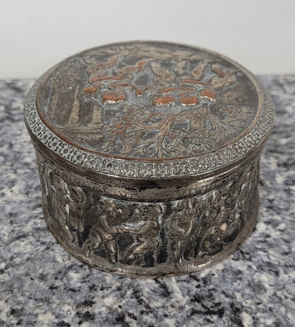 Unusual Antique silver over pottery Italian trinket box nicely decorated with Cherubs. It is in good original condition, please view photos as they help form part of the description.