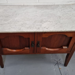 Blackwood two door white marble top cabinet. This would be ideal to be used as an entertainment unit, a TV stand or TV cabinet. In good original condition.
