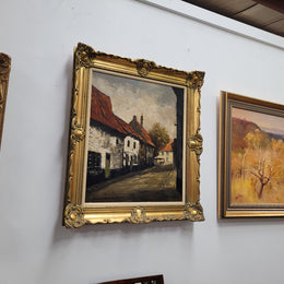 Dutch signed oil on canvas depicting village street in a beautiful gilt frame. It is in good original detailed condition and has been sourced from France.