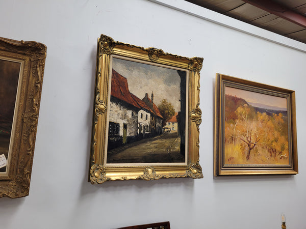 Dutch signed oil on canvas depicting village street in a beautiful gilt frame. It is in good original detailed condition and has been sourced from France.