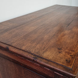 Early 19th Century French Oak chest of three drawers. It has beautiful handles and carvings. It is in good original detailed condition.