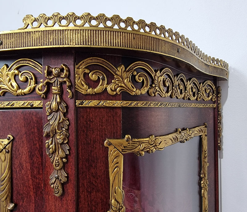 Louis XV style Walnut vitrine display cabinet with attractive ormolu mounts. Beautiful Maroon floral fabric backing with two glass shelves and cabriole legs with decorative ormolu mounts. In good original detailed condition.