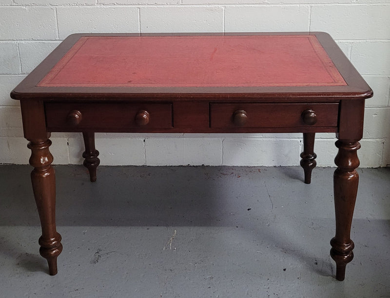 Victorian Cedar two drawer tooled leather topped desk with turned legs. In good original condition.