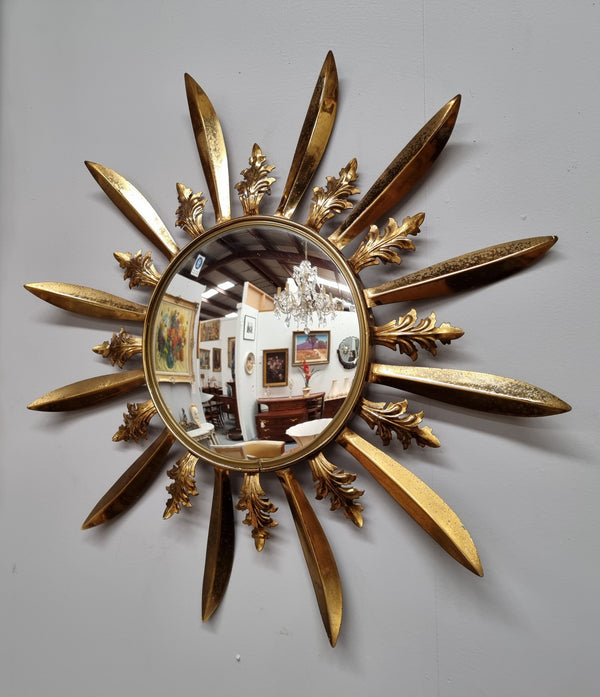 Stunning French Vintage gilt metal starburst convex mirror. It has been sourced from France and in good original detailed condition. Please note mirror does have some spotting due to age but only adds to its character.