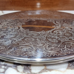 Two Strachan 30cm Silver Plate center table coasters. In good original condition.