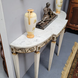 French Louis XVI style painted marble top console table. It is of pleasing narrow proportions and has been sourced from France. It is in good original detailed condition.