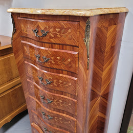 Stunning French seven drawer Kingwood and marquetry inlaid semainier with a beautiful marble top. In good original detailed condition.
