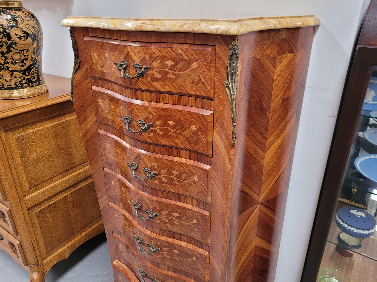 Stunning French seven drawer Kingwood and marquetry inlaid semainier with a beautiful marble top. In good original detailed condition.