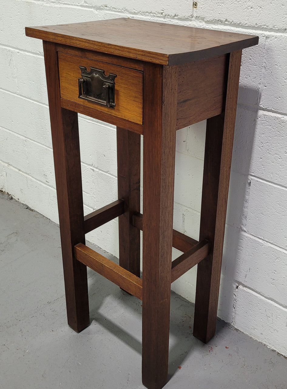 Small Arts and Crafts side table/bedside table. With drawer and is in good original detailed condition.