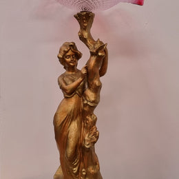 Late Victorian spelter table Centerpiece/comport featuring a woman holding an opalescent and ruby glass bowl. In good original condition with no damage to the ruby bowl.