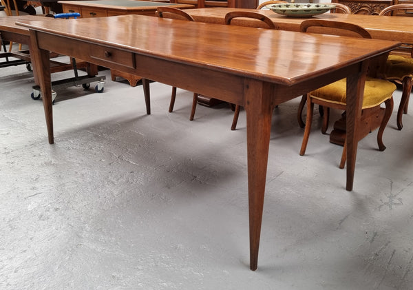 Antique French Oak Farmhouse table in fully restored condition. Features a single drawer and tapered legs.