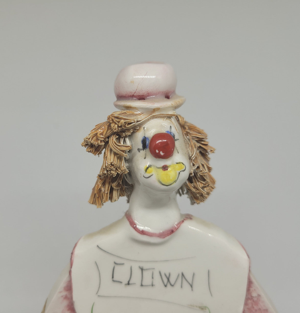 Signed pastel ceramic Italian clown figure. In good original condition.