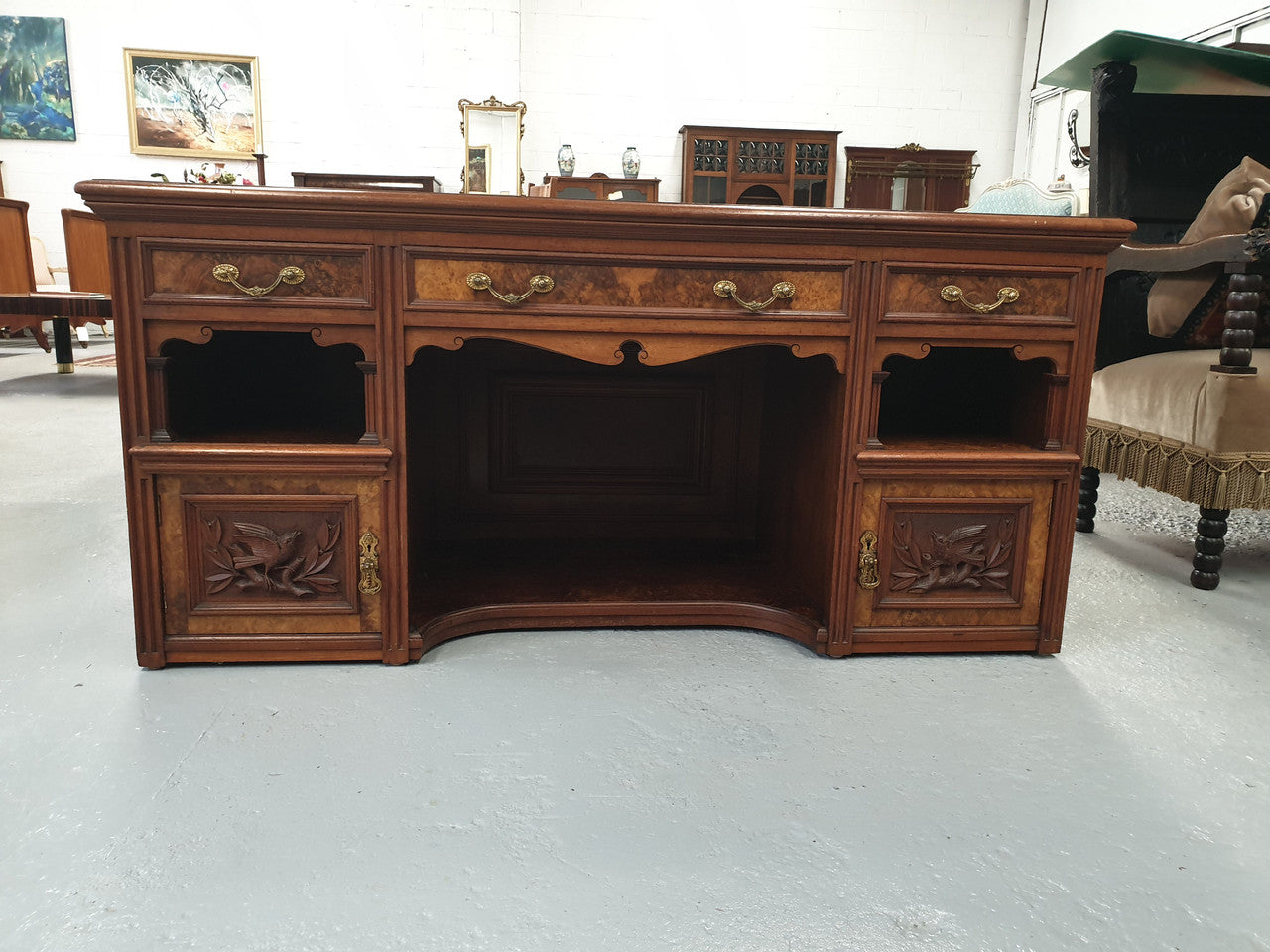 Victorian Burr Walnut ideal TV cabinet. Has plenty of room for a large TV and has plenty of storage space with 3 drawers and 2 cupboards. In good original condition.