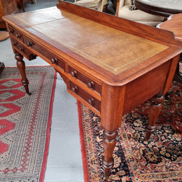 Lovely Victorian Cedar leather tooled  top desk, with five drawers on castors and of pleasing proportions. In very good original detailed condition and has been sourced locally.