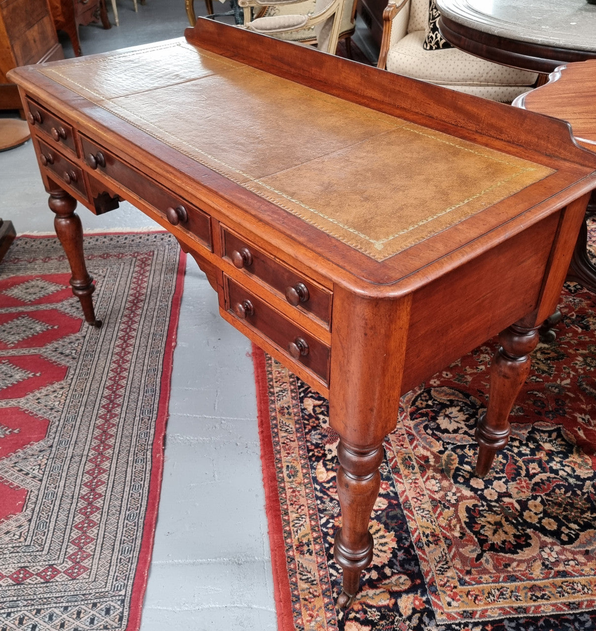 Lovely Victorian Cedar leather tooled  top desk, with five drawers on castors and of pleasing proportions. In very good original detailed condition and has been sourced locally.