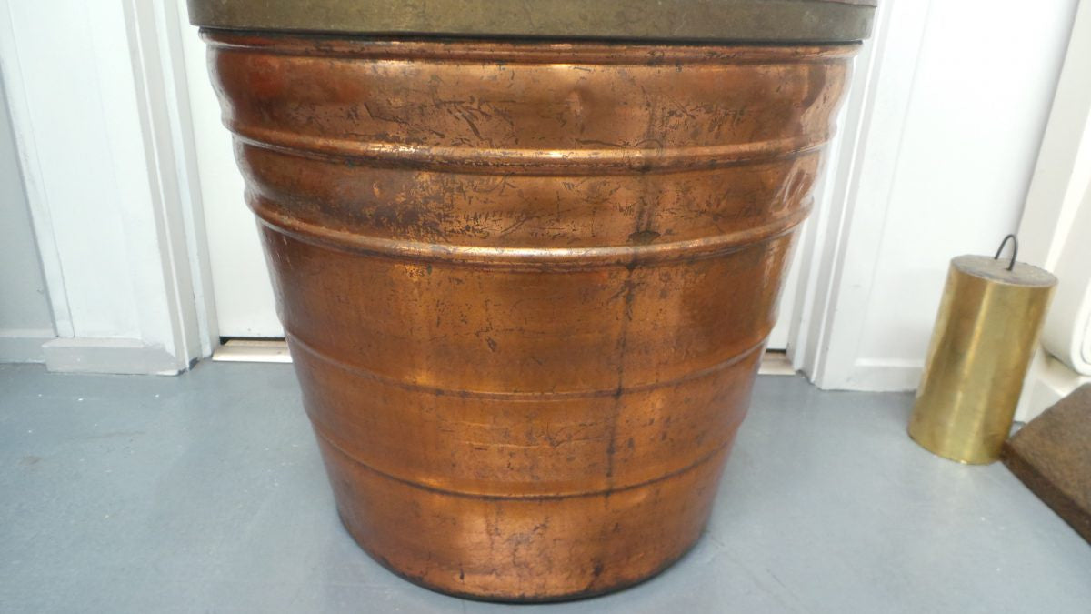 A fabulous French rustic antique copper and brass two handled bucket. Has loads of character and would make a great bucket for firewood. It is in very good original condition