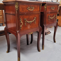 Appealing Louis XV style high quality bedside cabinets with black Portoro marble top and bronze mounts. They have been sourced from France and are in good original condition.