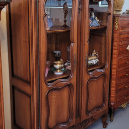 French Walnut Louis XV Style two half glass, door bookcase with three adjustable shelves. Sourced from France and in good original detailed condition.