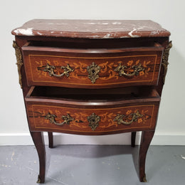 A stunning French petite two drawer inlaid Rosewood commode. In good original detailed condition.