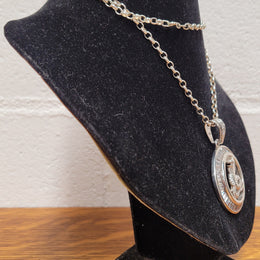 Sterling Silver pendant featuring a Cobra Snake with Cubic Zirconia surround. Heavy Bale with Cubic Zirconia. Pendant without Bale, 3.5cm Diameter. Includes 60 cm Sterling Silver Chain.