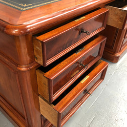 Antique French Mahogany and leather inset top double pedestal partners desk. Plenty of storage space with 9 long drawers on one side and space for someone to sit on the other side. In good restored condition. Circa 1880's.
