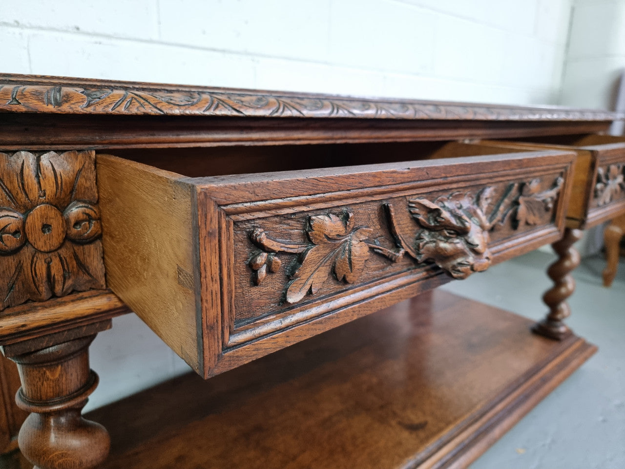 Antique French Oak Henry II style two drawer cabinet which would make an ideal TV cabinet or music unit. In good original detailed condition.