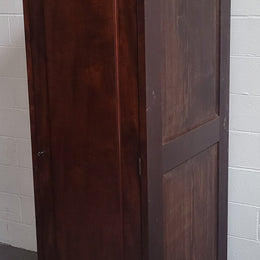 Unusual Victorian Flame Mahogany side wardrobe with side door. It has full hanging and six hooks. The wardrobe opens from a side door which can be locked with its key and has a markers mark stamp on the door. It is in good original condition.