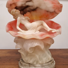A superb original hand carved Art Deco lamp. Alabaster and marble sculpture of a nude woman inside a clam shell. Italian, inscription to base. Circa 1920's. Subtle colouring to clam shell for a sunset effect. This is a world class example of a true Art Deco sculpture lamp. It is in good original detailed condition, please view photos as they help form part of the description.