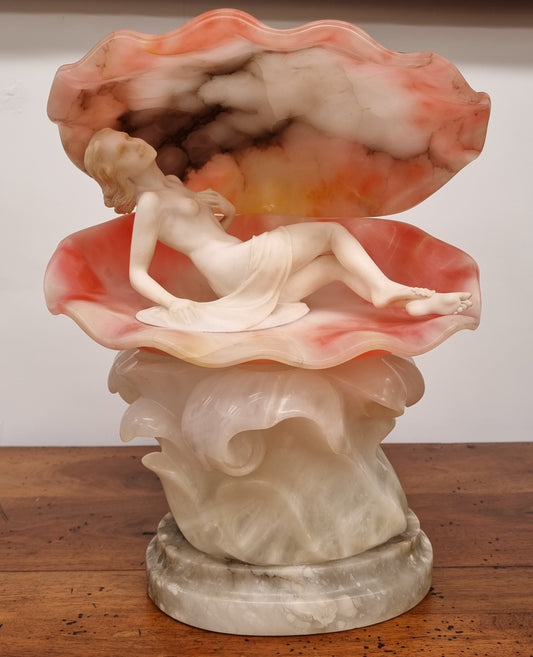 A superb original hand carved Art Deco lamp. Alabaster and marble sculpture of a nude woman inside a clam shell. Italian, inscription to base. Circa 1920's. Subtle colouring to clam shell for a sunset effect. This is a world class example of a true Art Deco sculpture lamp. It is in good original detailed condition, please view photos as they help form part of the description.