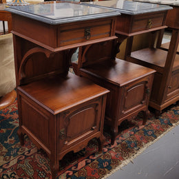 Pair of unusual transitional fruit wood marble top bedside cabinets. They have been sourced from France and are in good original detailed condition.