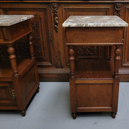 Pair of French Antique Oak marble top bedsides Henry II style. They have a drawer, cupboard and an open shelf for all your storage needs. They have been sourced from France and are in good original detailed condition.
