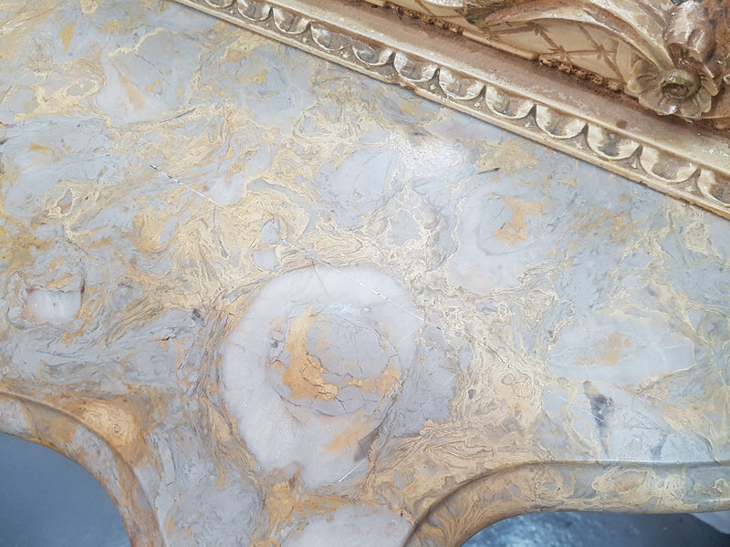 Beautifully carved Italian Rococo style painted console/hall table and mirror. An amazing coloured marble top showing sections of gold veins and is in good condition. Mantle mirror is retaining it's original mirror and showing ages spots.