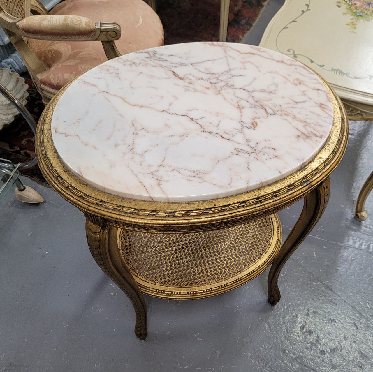 Stunning Louis XV style two tier marble topped gilt lamp/side table. It has been sourced from France and is in good original detailed condition.