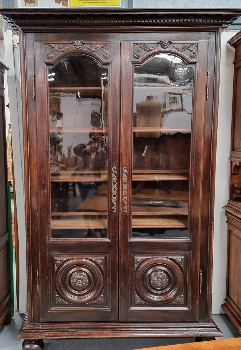 Substantial French Henry 2nd Walnut two door bookcase. It has five fully adjustable shelves and has been sourced from France. It is in good original detailed condition.