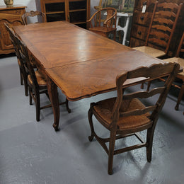 French Oak Louis XV style parquetry top extension table. It can sit six people when not extended and eight when fully extended. It has been sourced from France and is in original detailed condition.